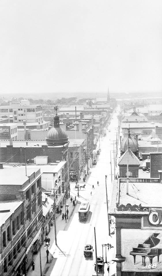 At the other end of Sparks Street looking west past Bank Street circa 1910-15. Christ Church in the distance. A horse drawing a sleigh at Bank and Sparks Street.