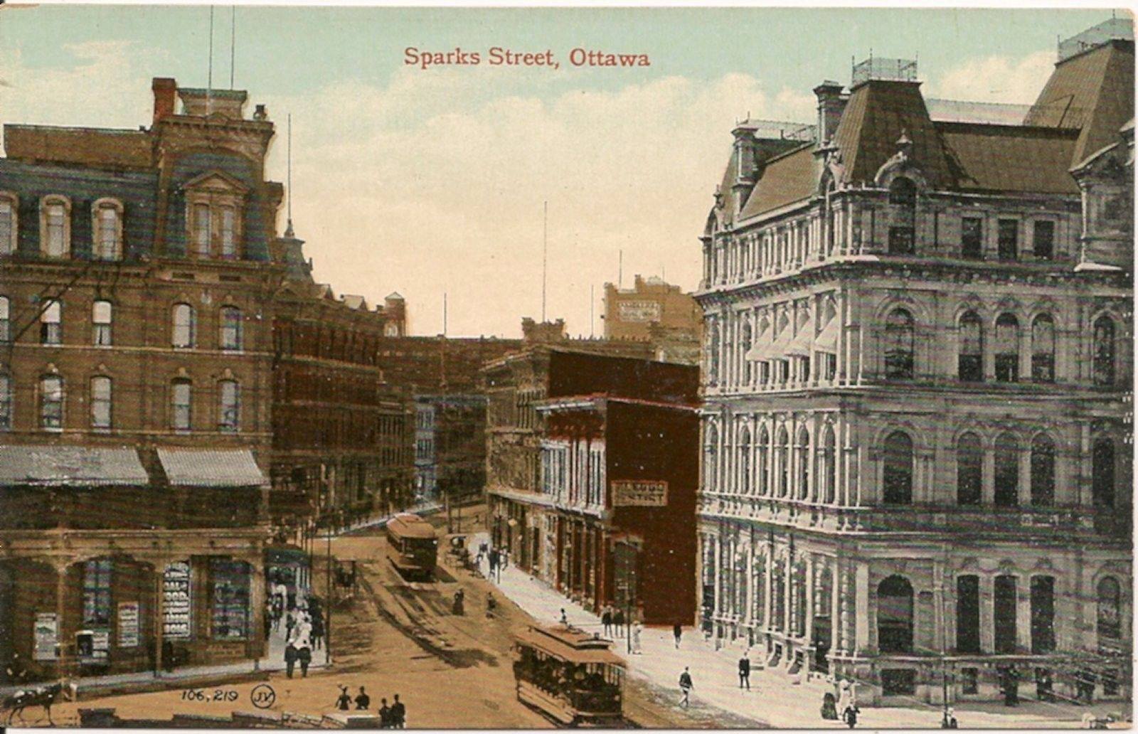 Looking west along Sparks Street, c.1910. Russell House Hotel on the left and the Old Post Office on the right, with a block of buildings, tucked in behind. More or less where the War Memorial is now. The closest streetcar is at